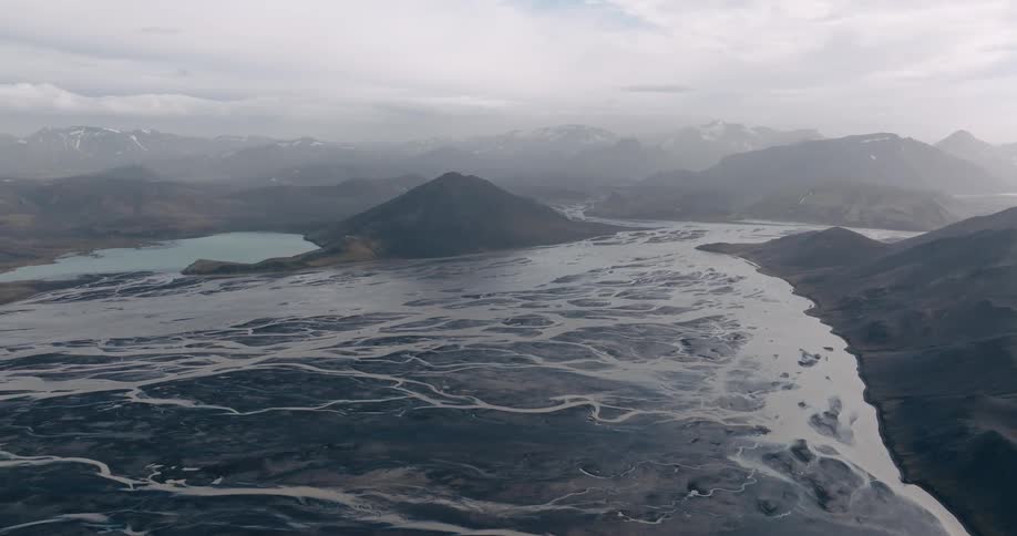 Aerial view of the river winding its way through the mountains