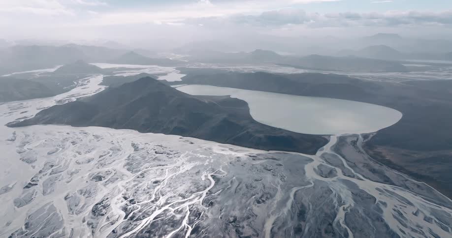 Aerial panorama of watermark mountains and a lake in the background