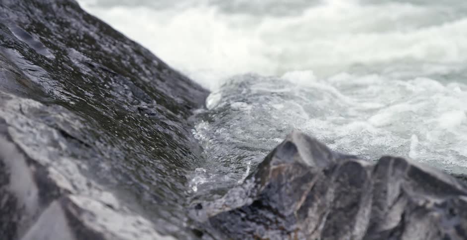Waves calmly coming ashore in a rocky area