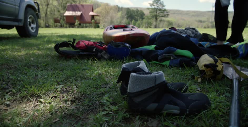 Person going through their belongings at their campsite