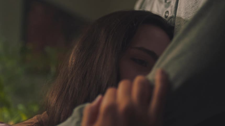 Portrait of a woman sleeping in a mans arms