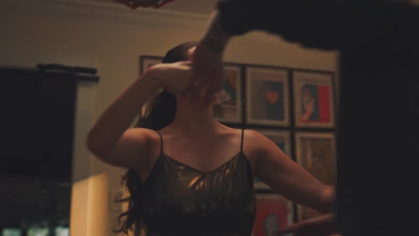 Couple dancing together in living room