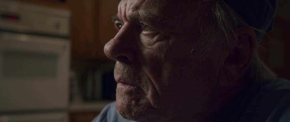 Portrait of an elderly man with a sad facial expression
