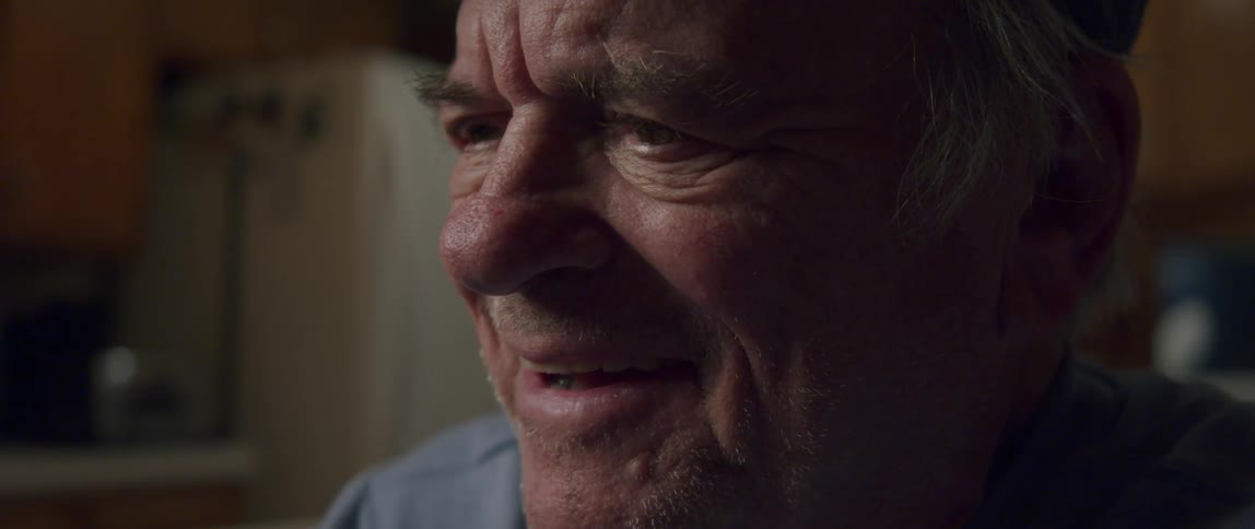 Portrait of an emotional elderly man giving a smile