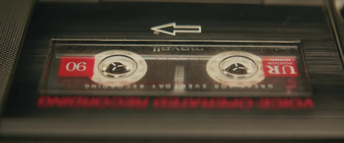 Close up of a cassette tape playing