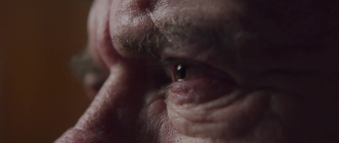 Close up of an elderly mans eyes crying