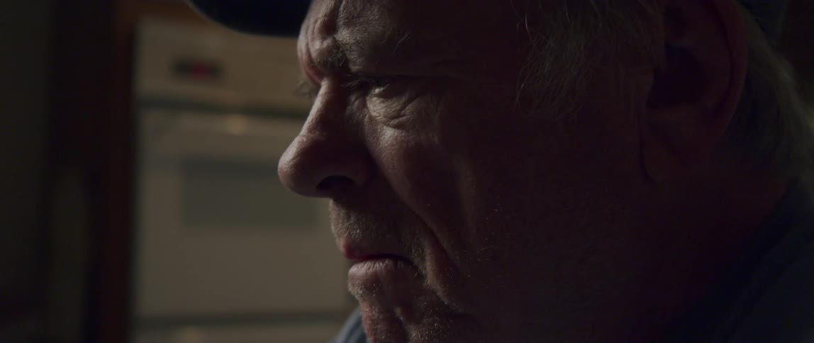 Side portrait of an emotional elderly man