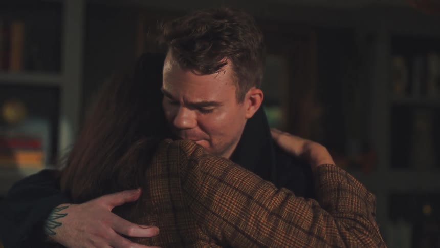 Man and woman embracing in an indoor space