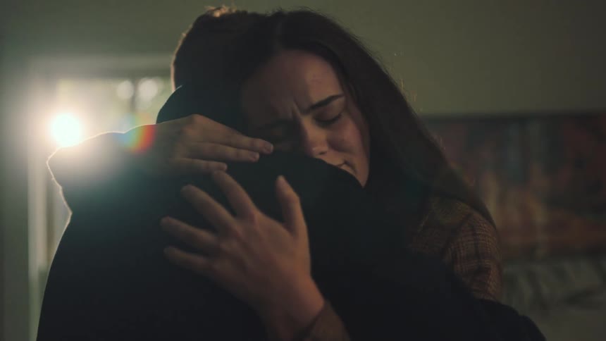 Woman and a man hugging each other