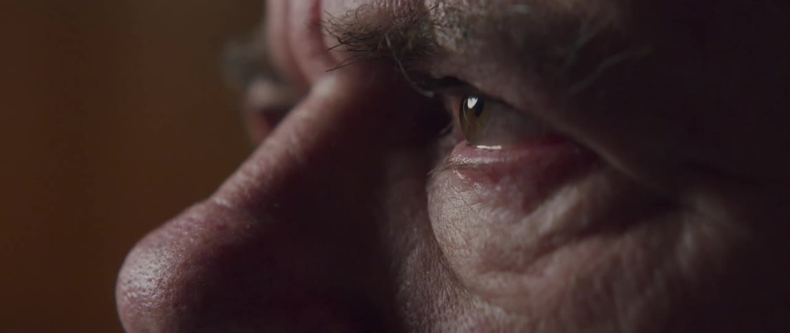 Closeup of an elderly mans eyes watering