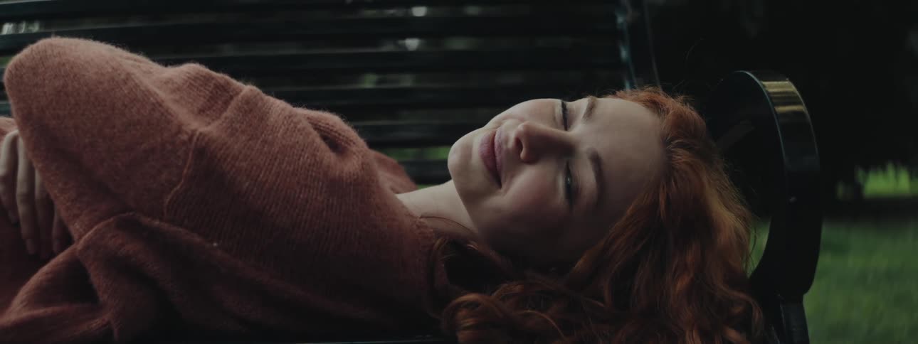 A clip of a lady laying on a chair