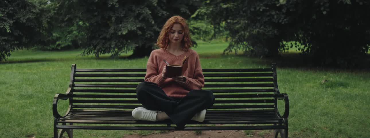 A clip of a lady siting and studying