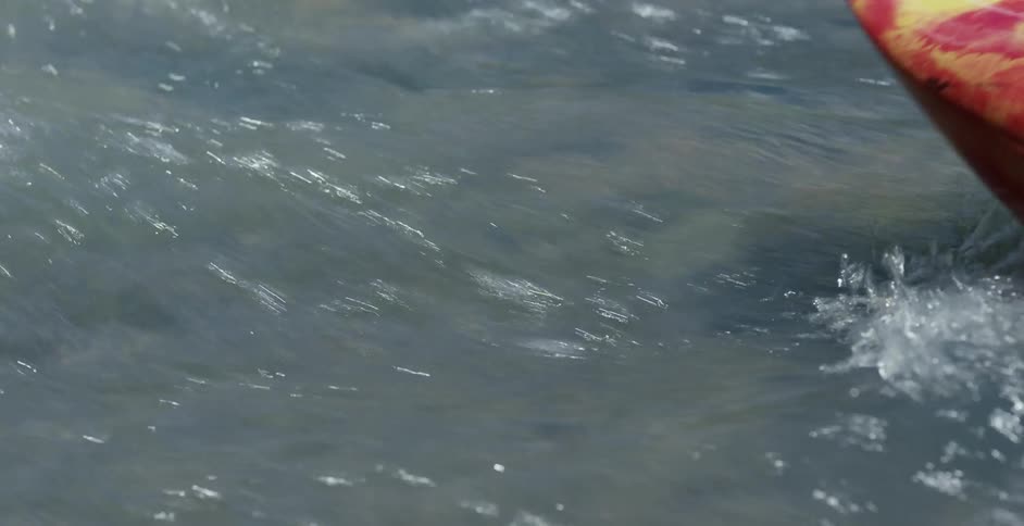 A kayak travels through the water