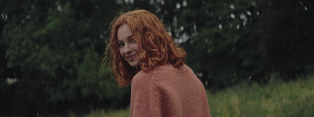 A clip of a lady walking and smiling