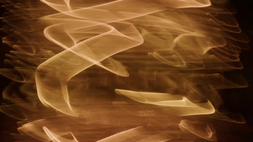 Abstract lights moving against black background