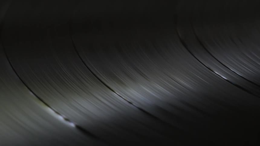 Close up of a vinyl record spinning