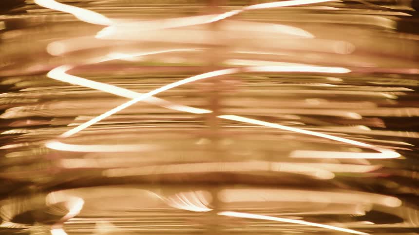 Abstract golden colored light turning on
