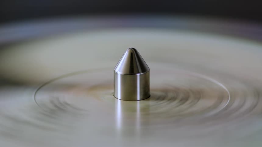 Vinyl record album spinning on a turntable in slow motion