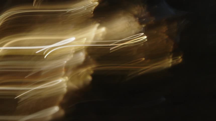 A closeup of an illuminated decorative light bulb