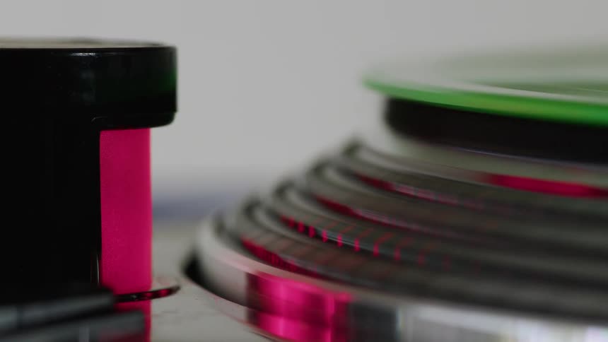 A close up clip of a rolling colored circle