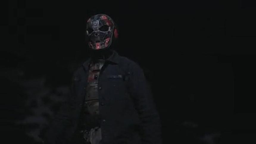 Person wearing an iron mask walking through a natural environment at night