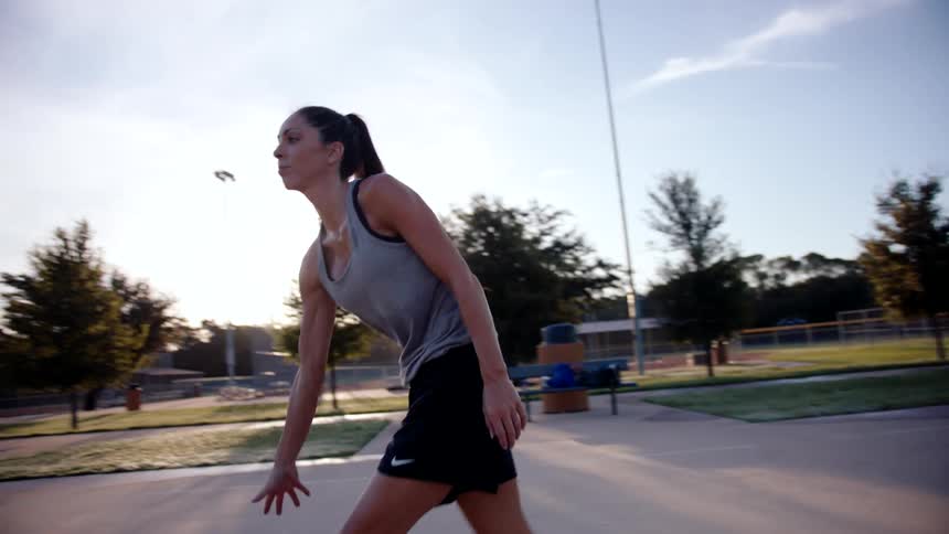 Woman with a basketball preparing for a shot on the court