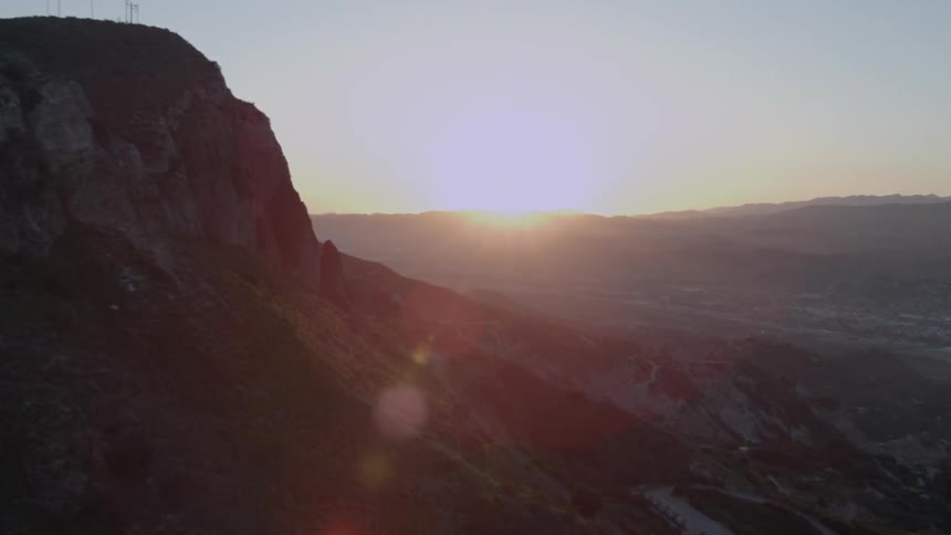 The sun shines bright on the horizon