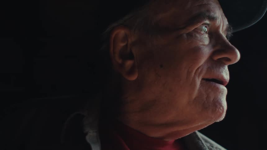 Face of a happy elderly man in an indoor space
