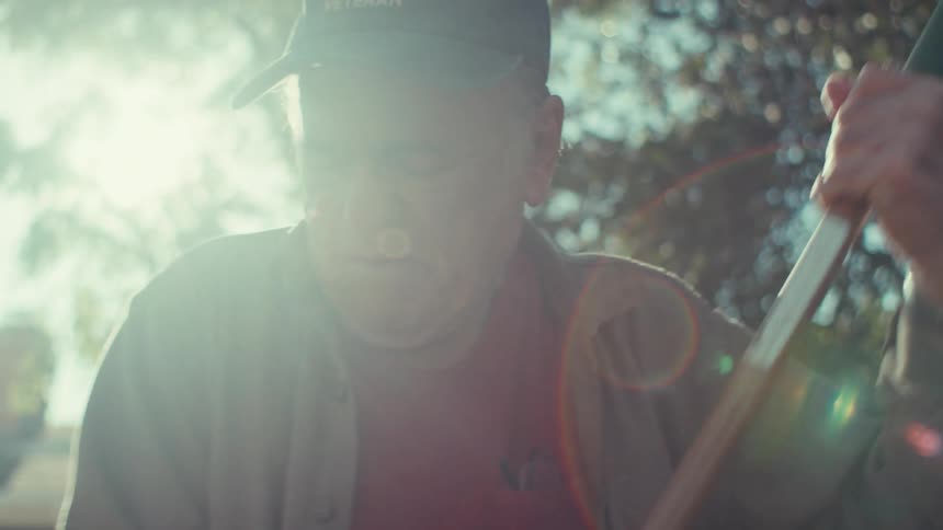 An image of an elderly man doing some sanitation