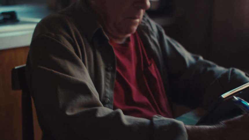 A man is using his tablet at home
