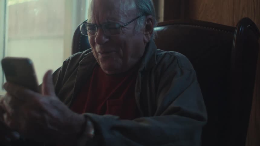 A clip of an elderly man laughing hard