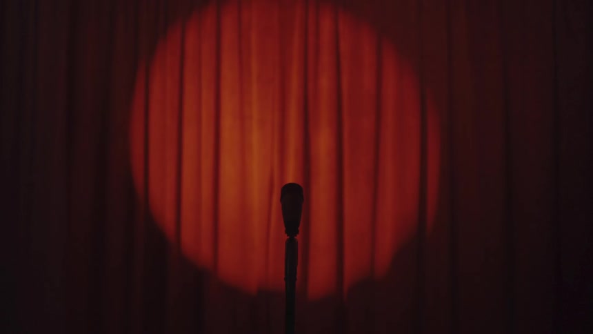 The spotlight is on the red curtain
