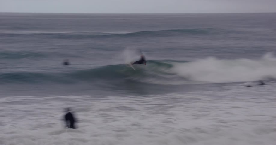 Men are surfing waves in the ocean