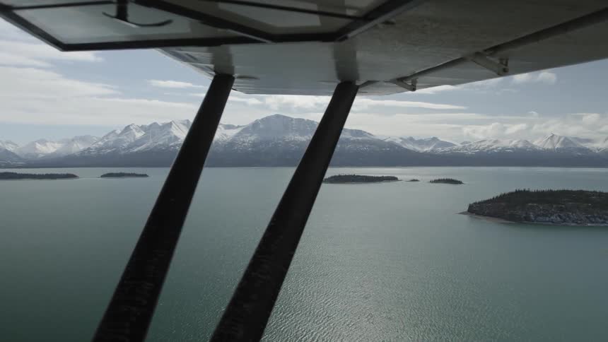 View looking out of an aircraft over the water