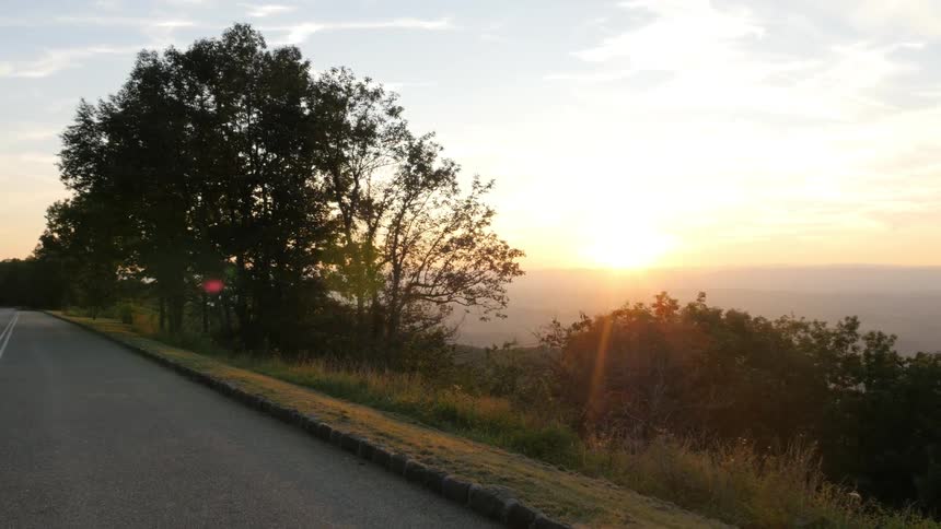 A first-person view of driving down a mountain road