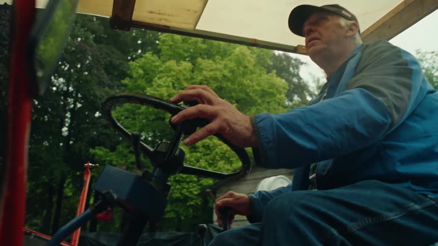 A clip of an elderly man driving