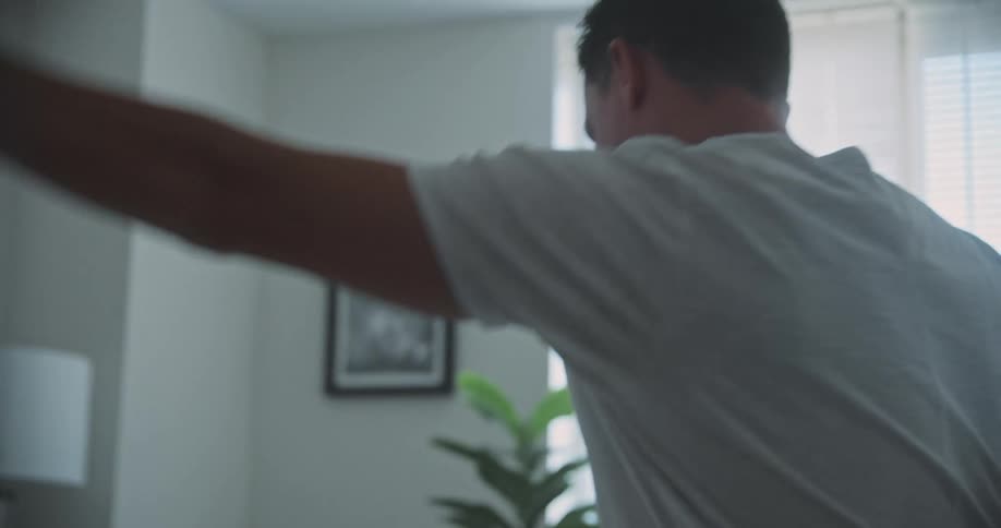 A clip of a person making a bed
