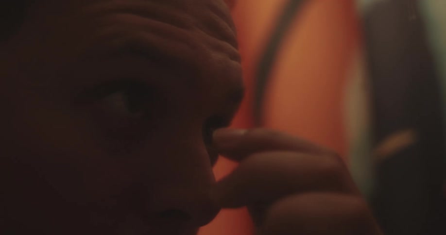 Portrait of a man with his hand on his nose
