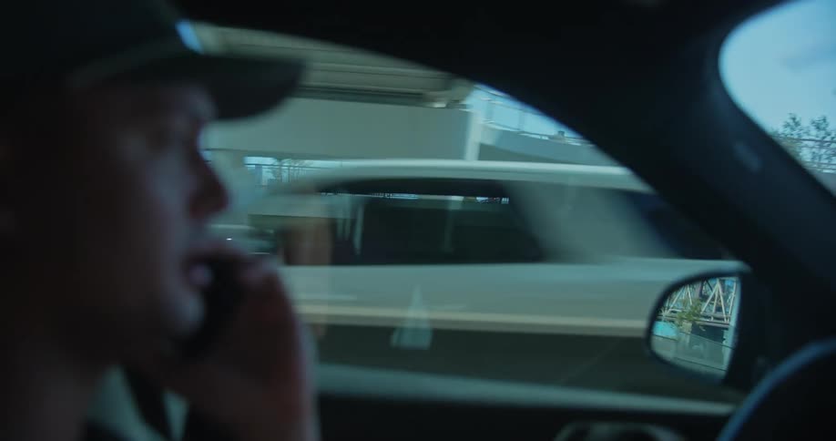 Person talking on smartphone while driving