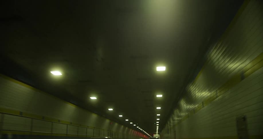 Traffic travels through the long tunnel