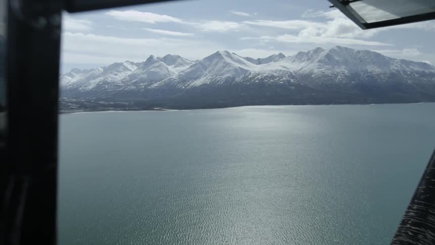 View of mountains and a lake looking out of an aircraft