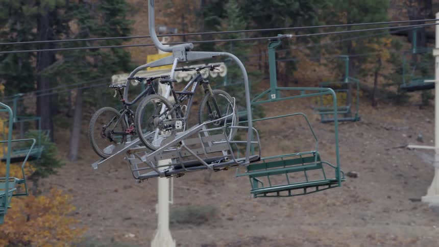 Two bicycles on a sky lift sort of ride