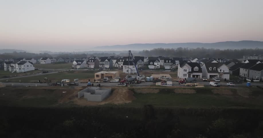 Aerial panorama of an urban city with a house being built