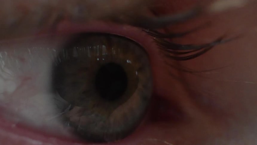 A close up clip of an eyeball with Pupils dilating