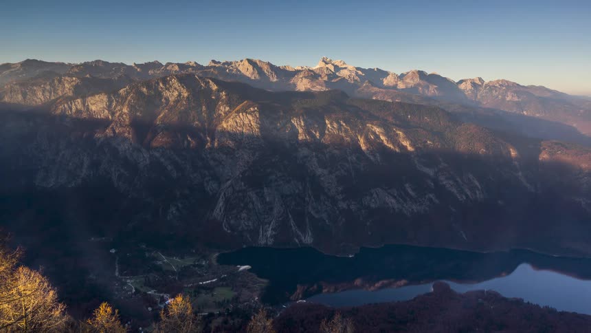 Mountain landscape with a lake and the day getting dark