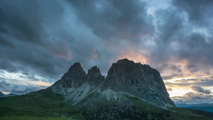 Landscape of an imposing mountain on a cloudy day and the sun setting