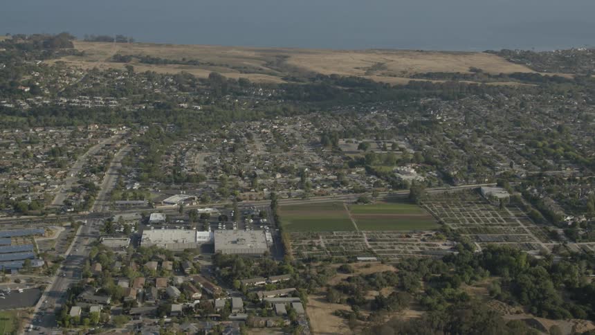 Aerial view of a large town next to the water