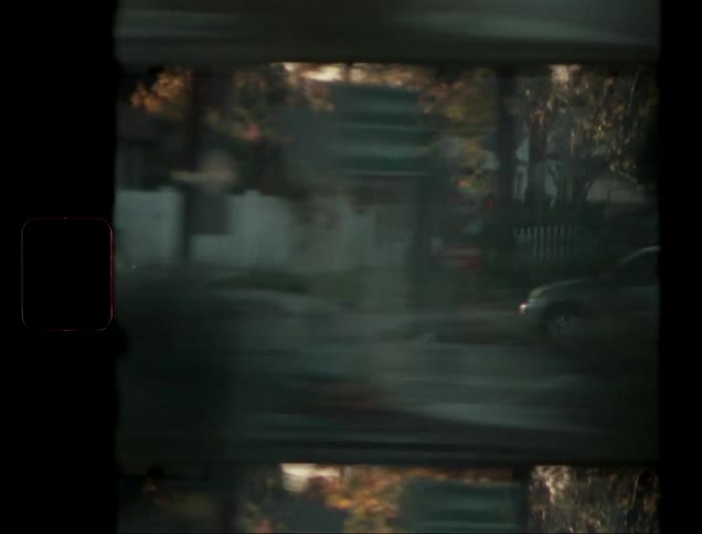 The golden light of sunset bathes the highway as the car speeds past