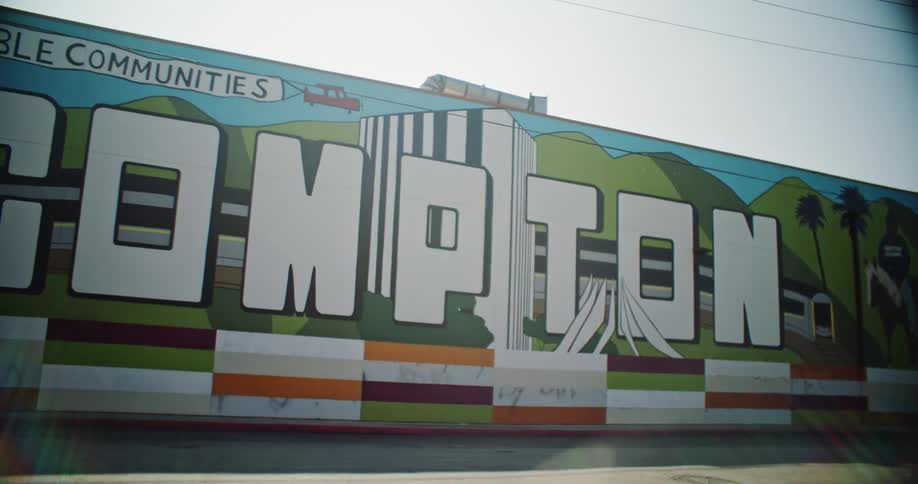 A colorful drawing with white writing on a large wall