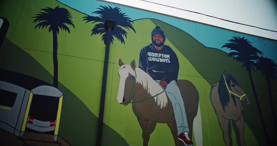 A large mural on a building in compton california